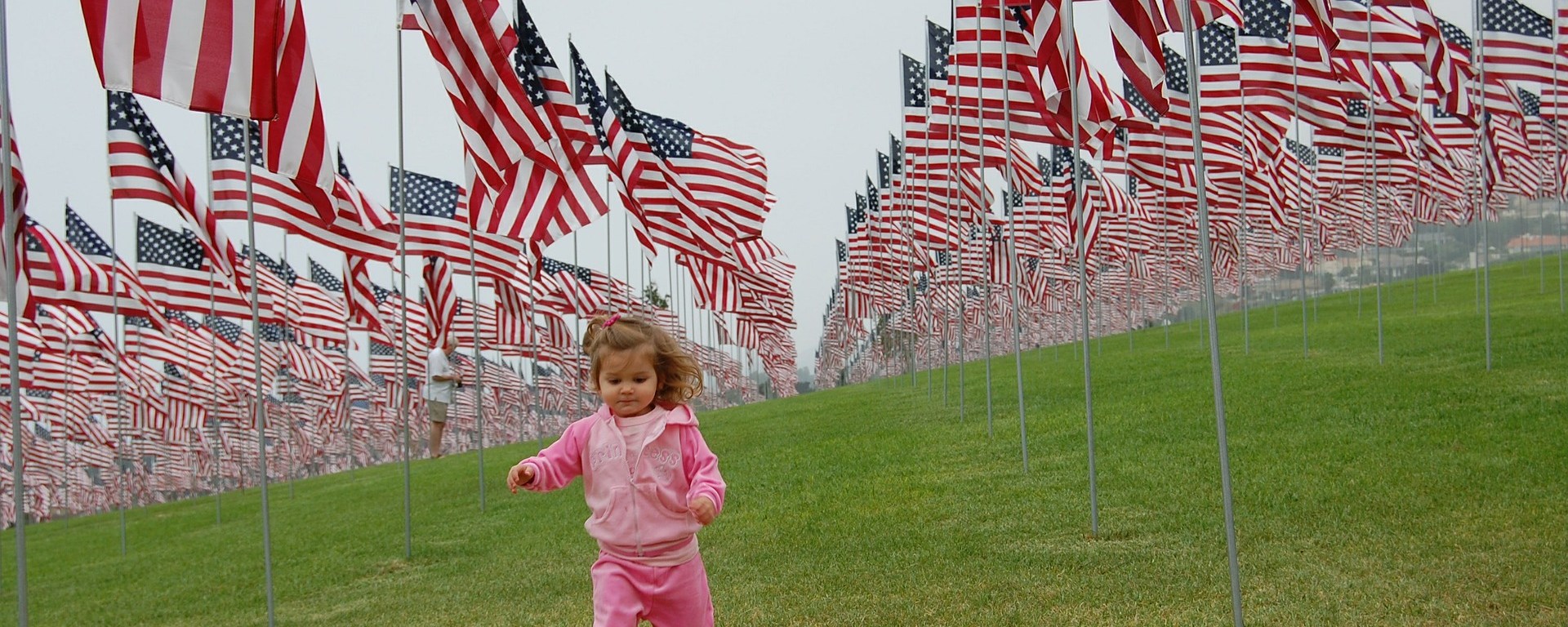 toddler,patriot,patriotic,girl,running,flags,usa,america,stars and stripes,lawn,grass,freedom,young,child,kid,happy,cute,childhood,outdoor,green,park,memorial day,veterans day,july 4th,princess,pink,DONCHARISMA