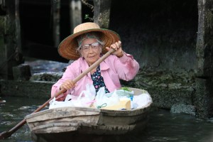 elderly woman,boat,vessel,courage,strength,age,paddling,channel,transport,pink,hat,old,river,cannal,hard life, DON CHARISMA